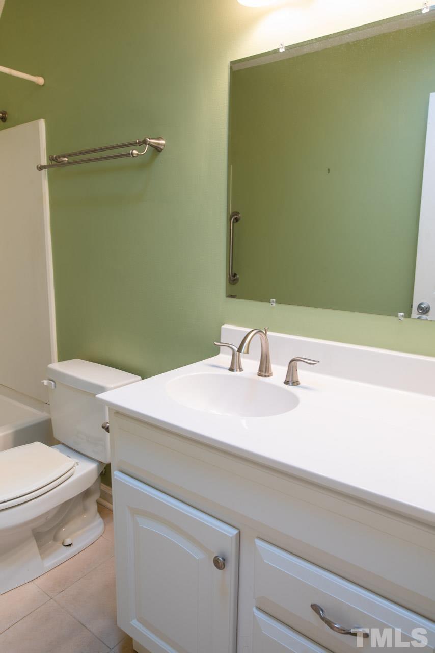 116 Baldwin Drive Durham, NC 27712 - Photo 16 of 33 a bathroom with a sink a toilet and shower