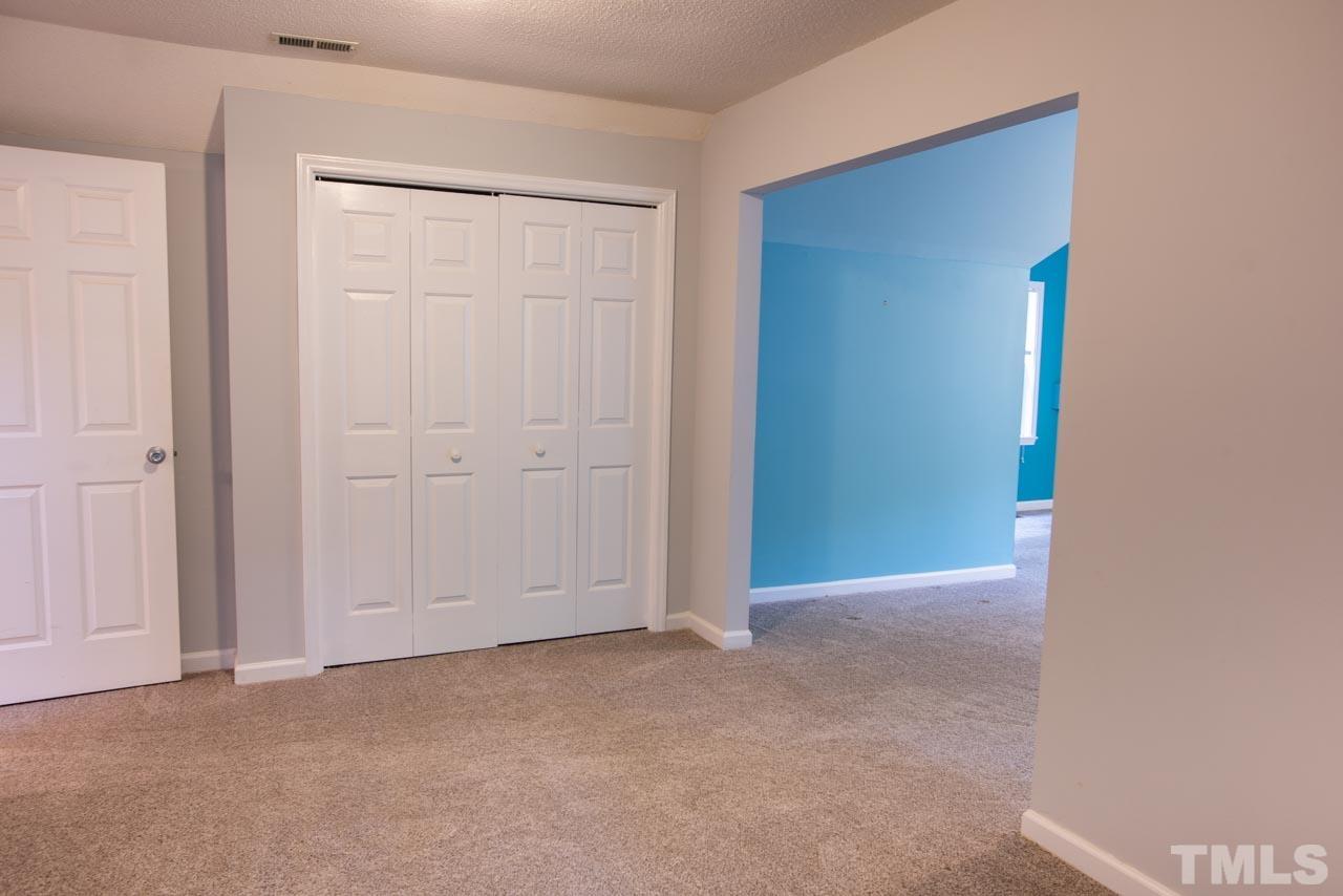 116 Baldwin Drive Durham, NC 27712 - Photo 19 of 33 an empty room with closet area
