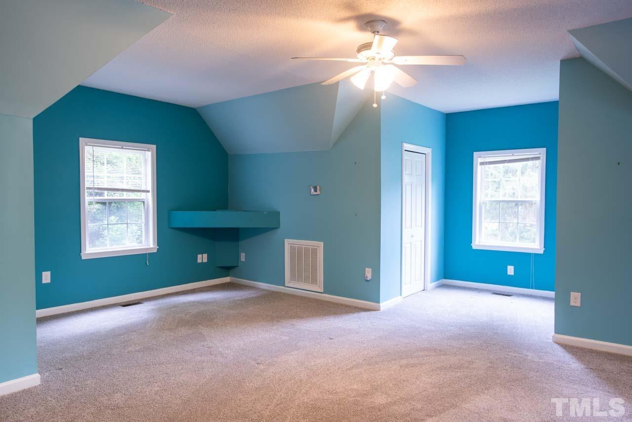 116 Baldwin Drive Durham, NC 27712 - Photo 21 of 33 an empty room with windows and fan