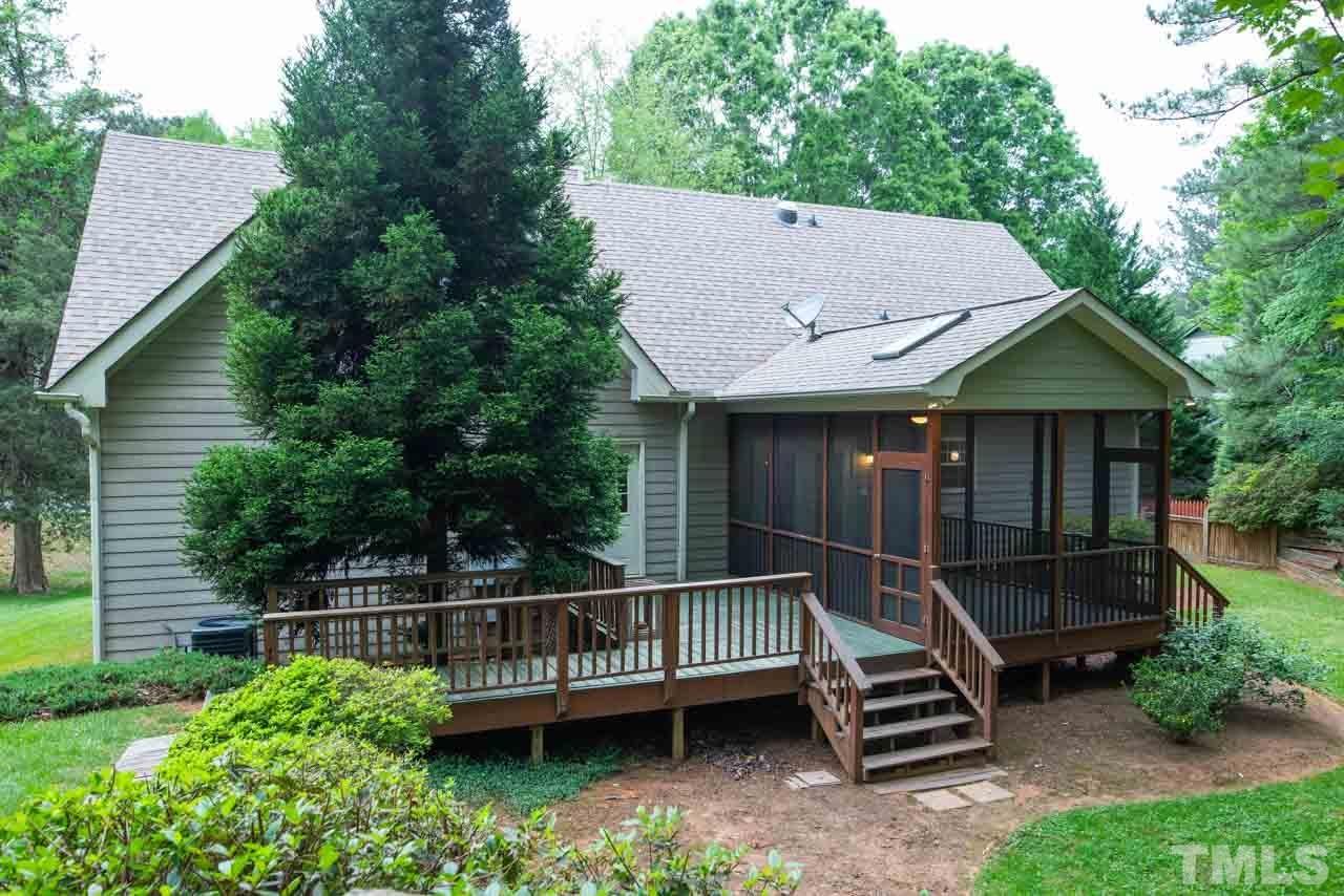 116 Baldwin Drive Durham, NC 27712 - Photo 29 of 33 a view of a house with wooden deck and furniture
