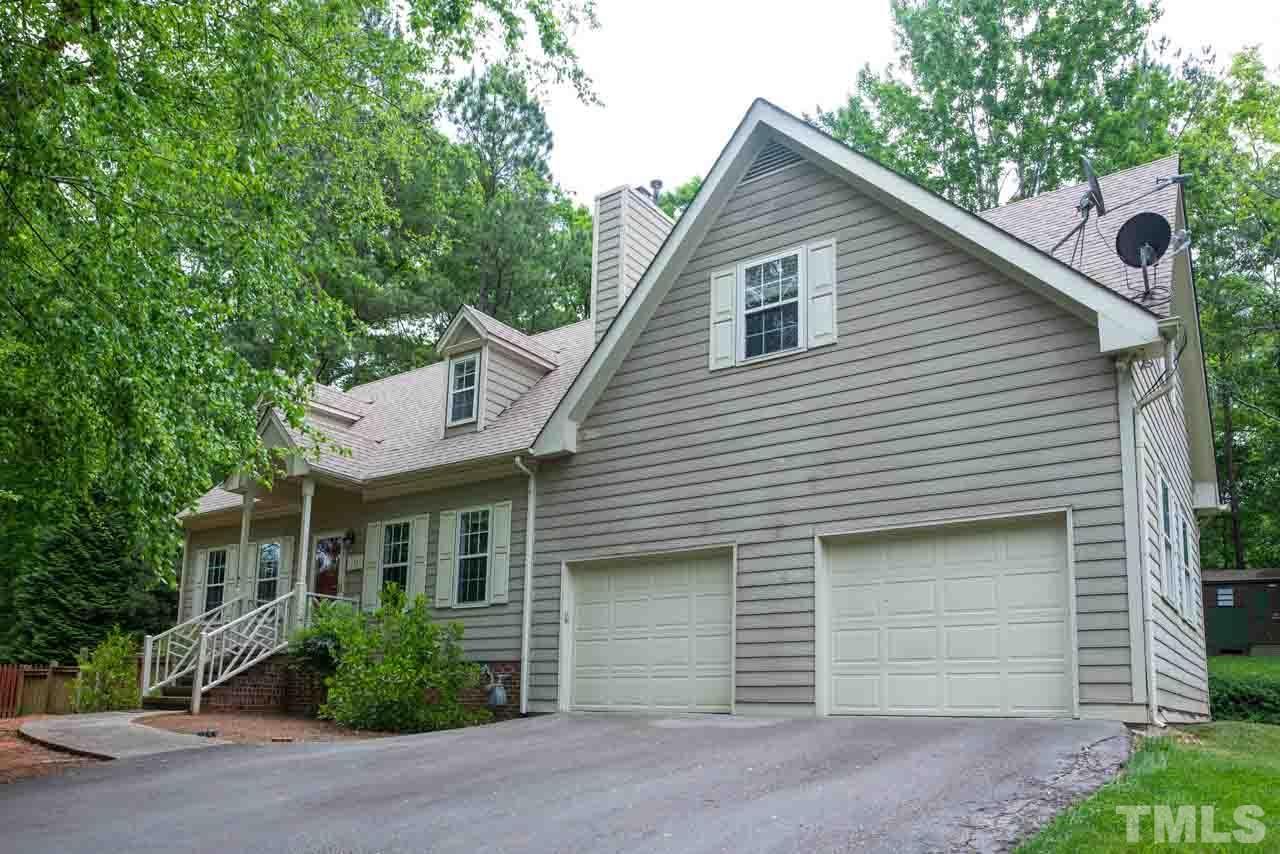 116 Baldwin Drive Durham, NC 27712 - Photo 33 of 33 a front view of a house with a yard and garage