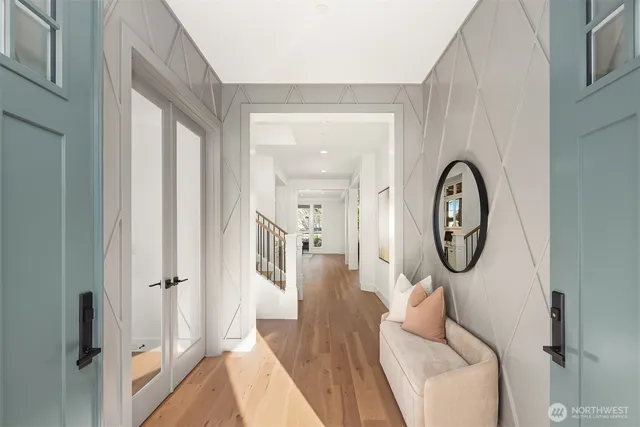 a living room with furniture a mirror and a window