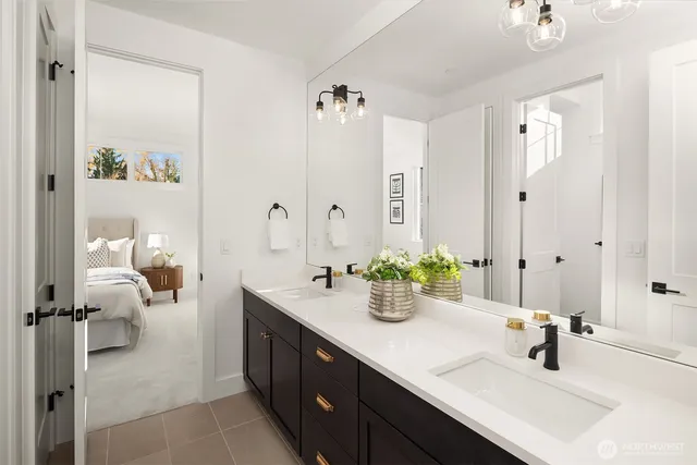 a bathroom with a double vanity sink mirror and double