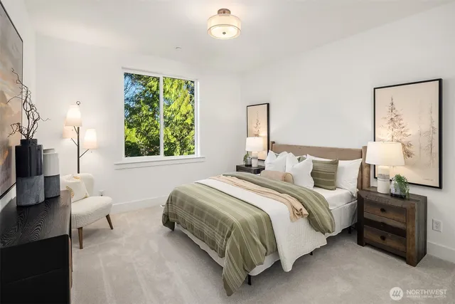 a bedroom with a bed and a couch