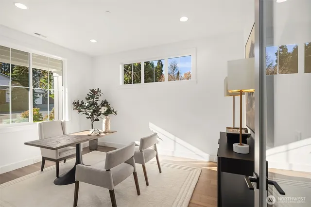 a dining room with furniture and window