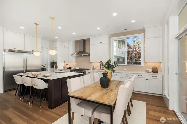 a kitchen with a table and chairs in it