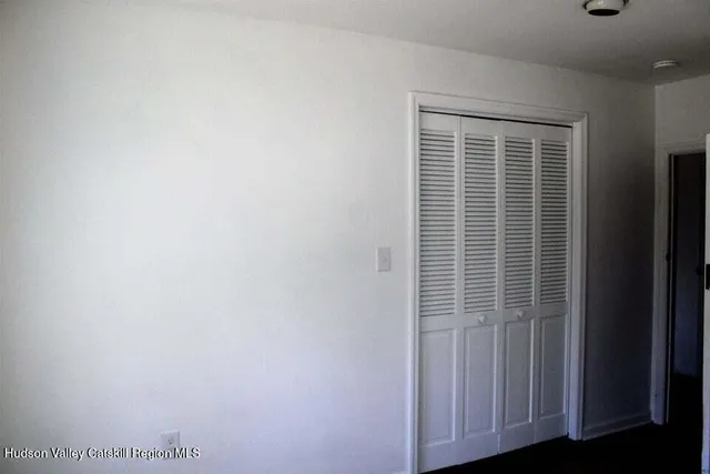 a view of a closet area with a window