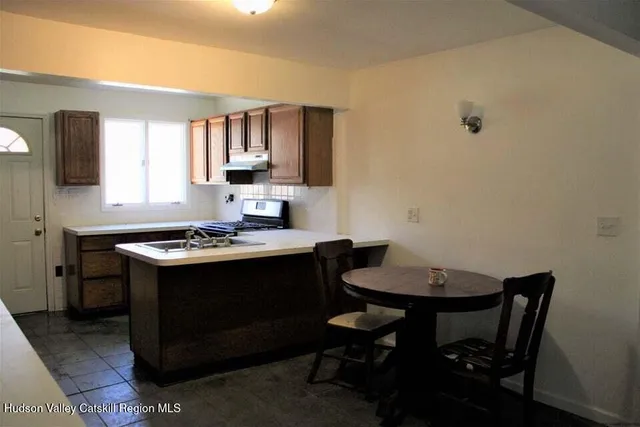 a view of a kitchen area with furniture and window