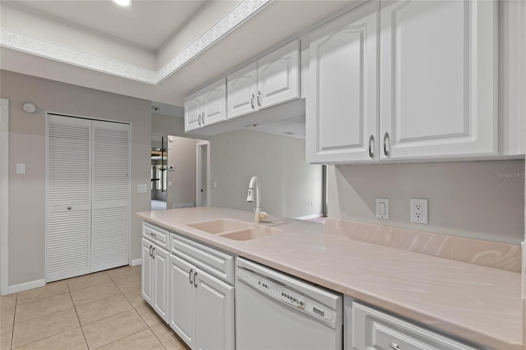 11241 Rollingwood Drive Port Richey, FL 34668 - Photo 11 of 26 a kitchen with appliances cabinets and a counter top space