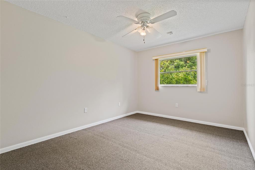11241 Rollingwood Drive Port Richey, FL 34668 - Photo 18 of 26 an empty room with a window