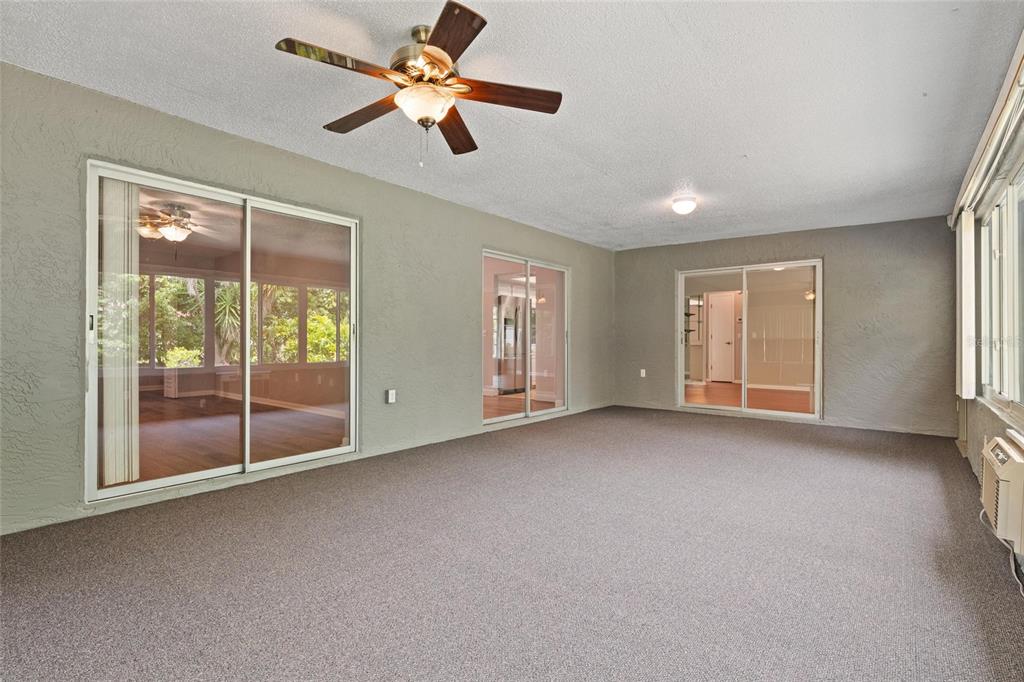 11241 Rollingwood Drive Port Richey, FL 34668 - Photo 20 of 26 a view of empty room with ceiling fan
