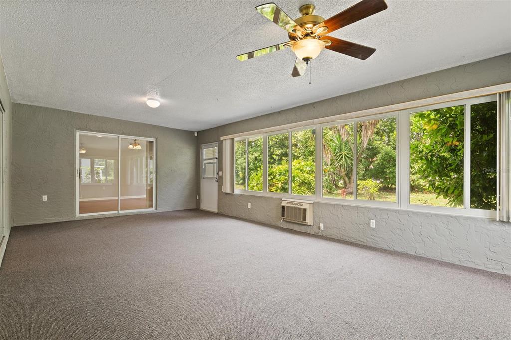 11241 Rollingwood Drive Port Richey, FL 34668 - Photo 21 of 26 a view of an empty room with a window