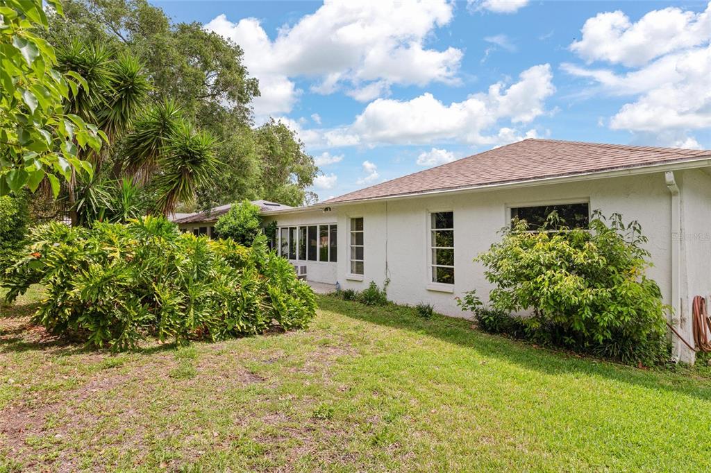 11241 Rollingwood Drive Port Richey, FL 34668 - Photo 25 of 26 a view of a house with a backyard