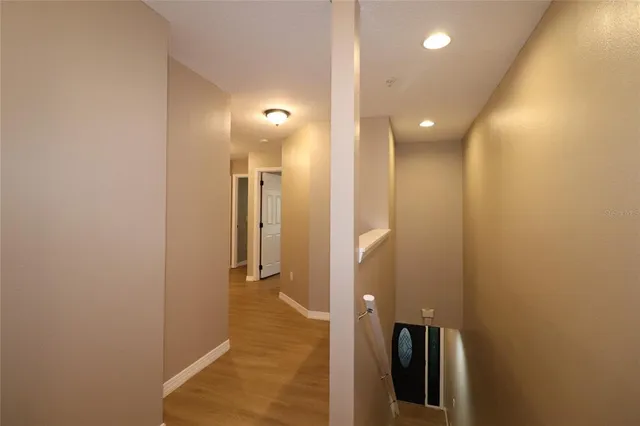 wooden floor with a bathroom