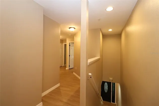 a bathroom with a glass shower door and a sink