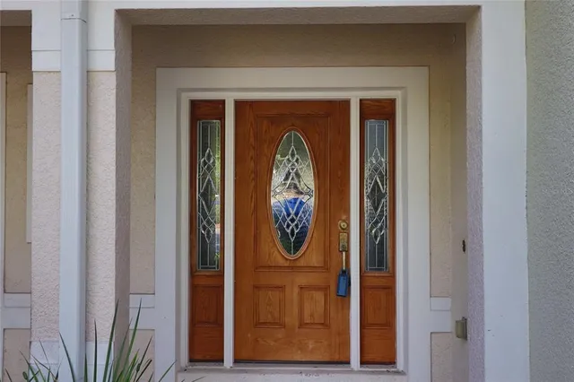 a front view of a door door with a bench