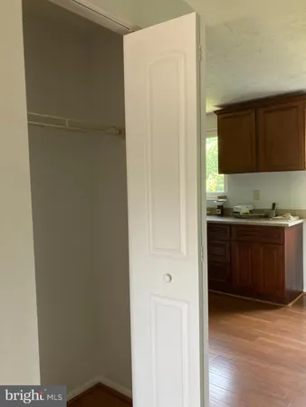a view of cabinets and wooden floor