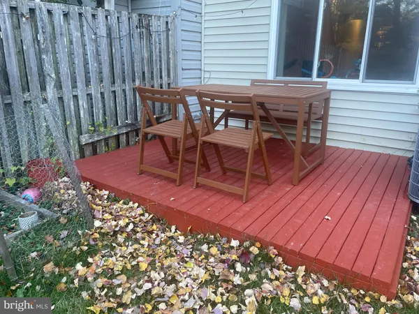 a view of a backyard with sitting area