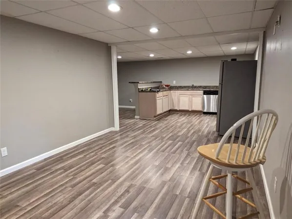 a view of kitchen with cabinets