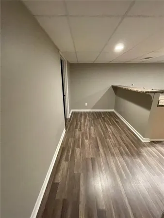 a view of wooden floor in a hallway