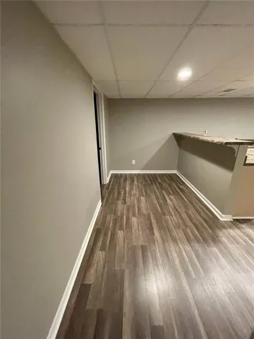 a view of wooden floor in a hallway