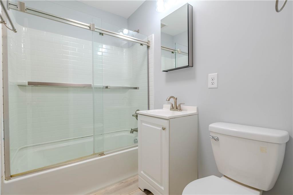 16 Drexel Drive Northwest Rome, GA 30165 - Photo 16 of 27 a bathroom with a toilet a sink and shower