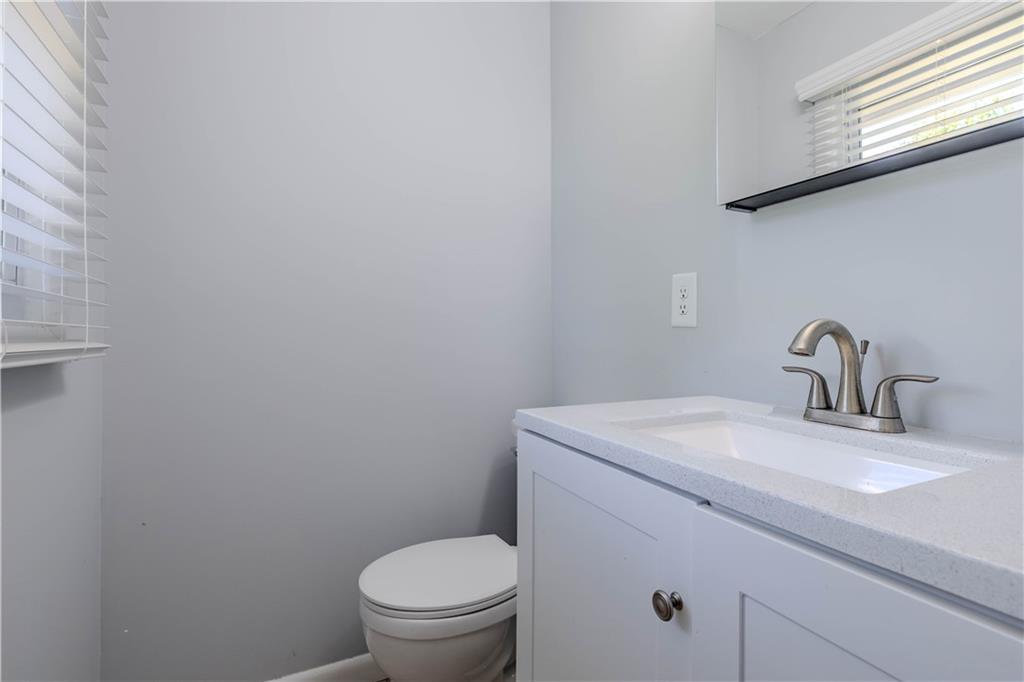 16 Drexel Drive Northwest Rome, GA 30165 - Photo 19 of 27 a bathroom with a sink a toilet and mirror