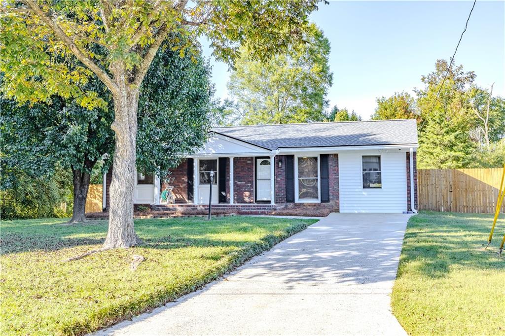 16 Drexel Drive Northwest Rome, GA 30165 - Photo 5 of 27 a front view of a house with a yard table and chairs