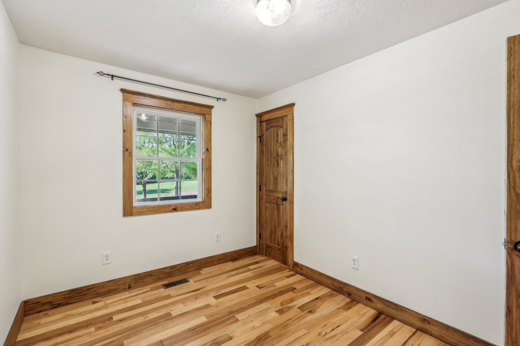 46 Seay Lane Erin, TN 37061 - Photo 18 of 47 a view of wooden floor and windows in a room