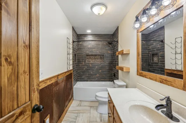 a bathroom with a sink a bathtub and shower