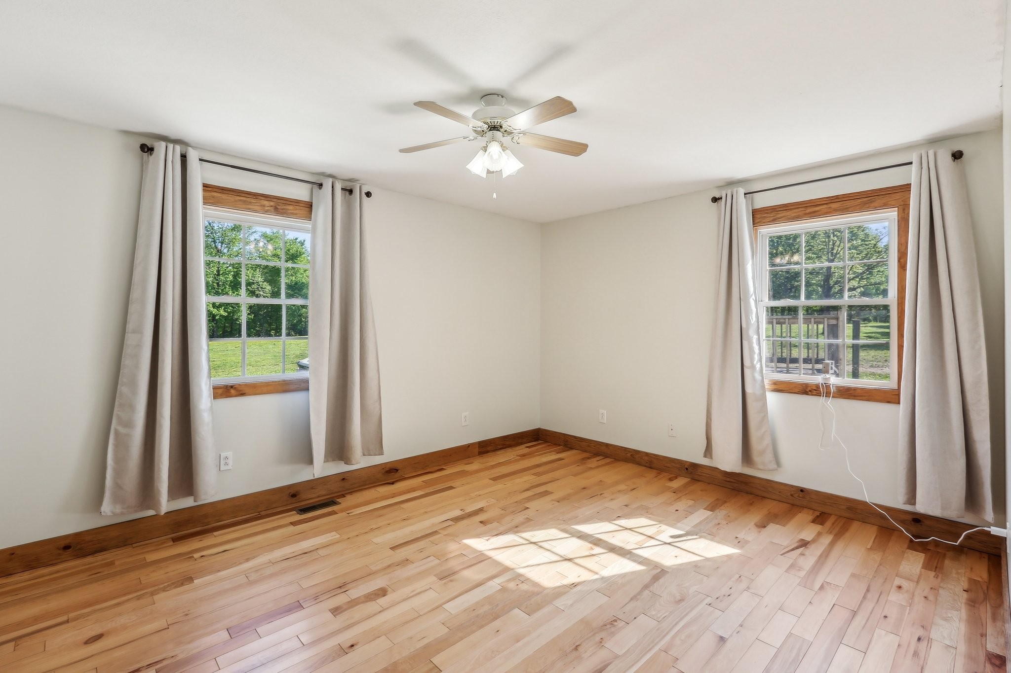 46 Seay Lane Erin, TN 37061 - Photo 22 of 47 a view of an empty room with wooden floor and a window