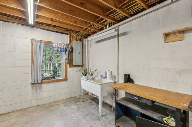 a backyard of a house with outdoor seating