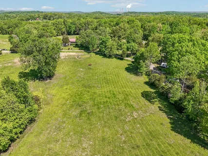 a view of a lake with a yard