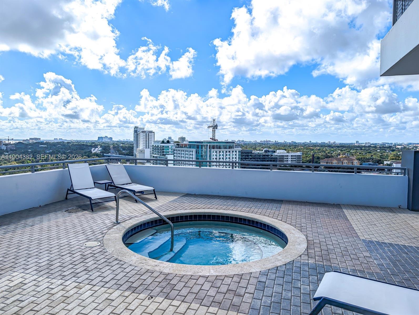 60 Southwest 13th Street, Unit 1612 Miami, FL 33130 - Photo 20 of 24 a terrace with a table and chairs