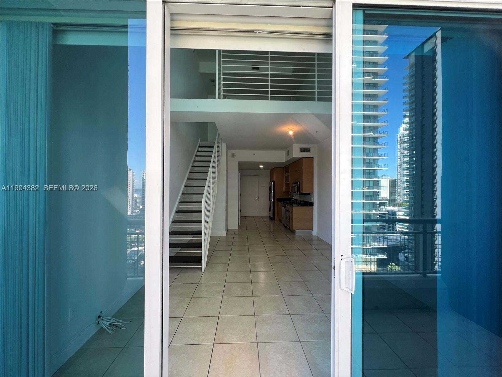 60 Southwest 13th Street, Unit 1612 Miami, FL 33130 - Photo 4 of 24 a view of a porch and a door