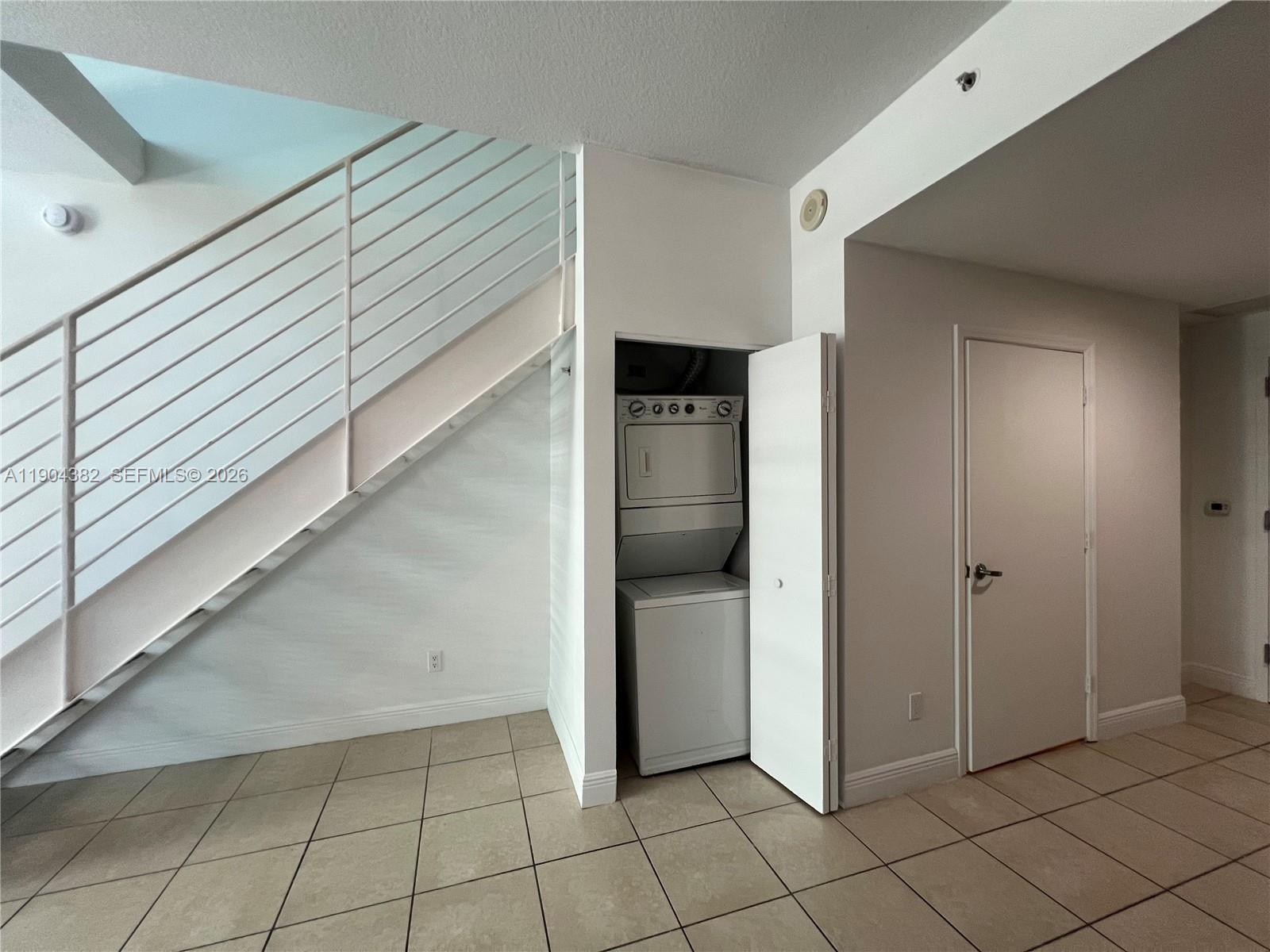 60 Southwest 13th Street, Unit 1612 Miami, FL 33130 - Photo 9 of 24 a view of a hallway to rooms