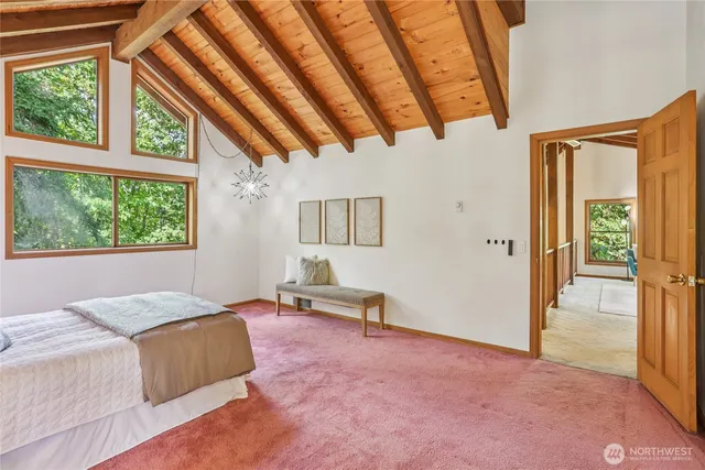 a bed room with a bed and a chair