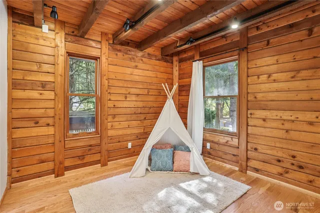 a view of a wooden door and outdoor space