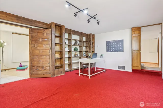 a living room with furniture and a table