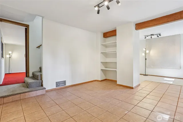 a view of livingroom with hardwood floor and cabinet