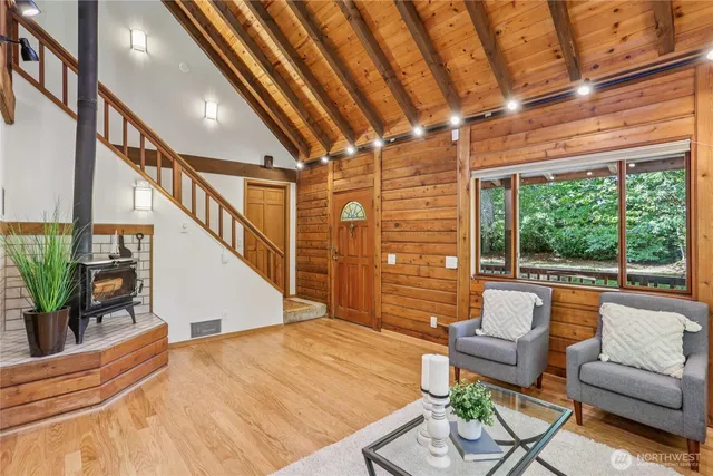 a view of a livingroom with furniture and staircase