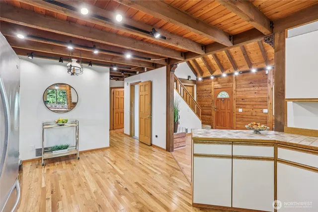 a view of an entryway with wooden floor
