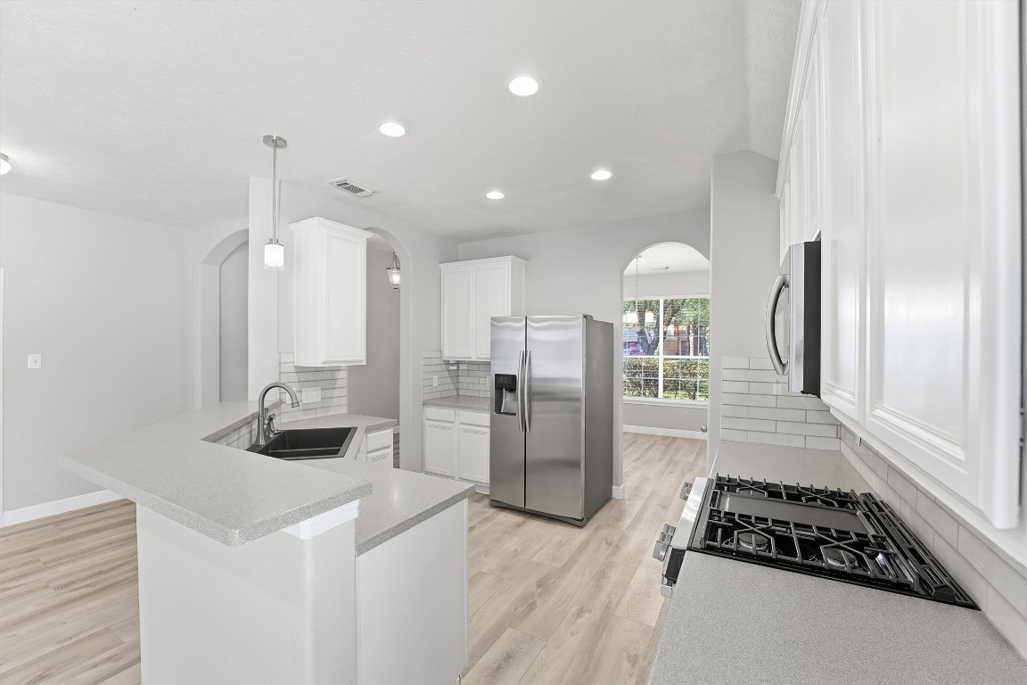23301 Tuttle Court Porter, TX 77365 - Photo 18 of 50 a kitchen with refrigerator and window
