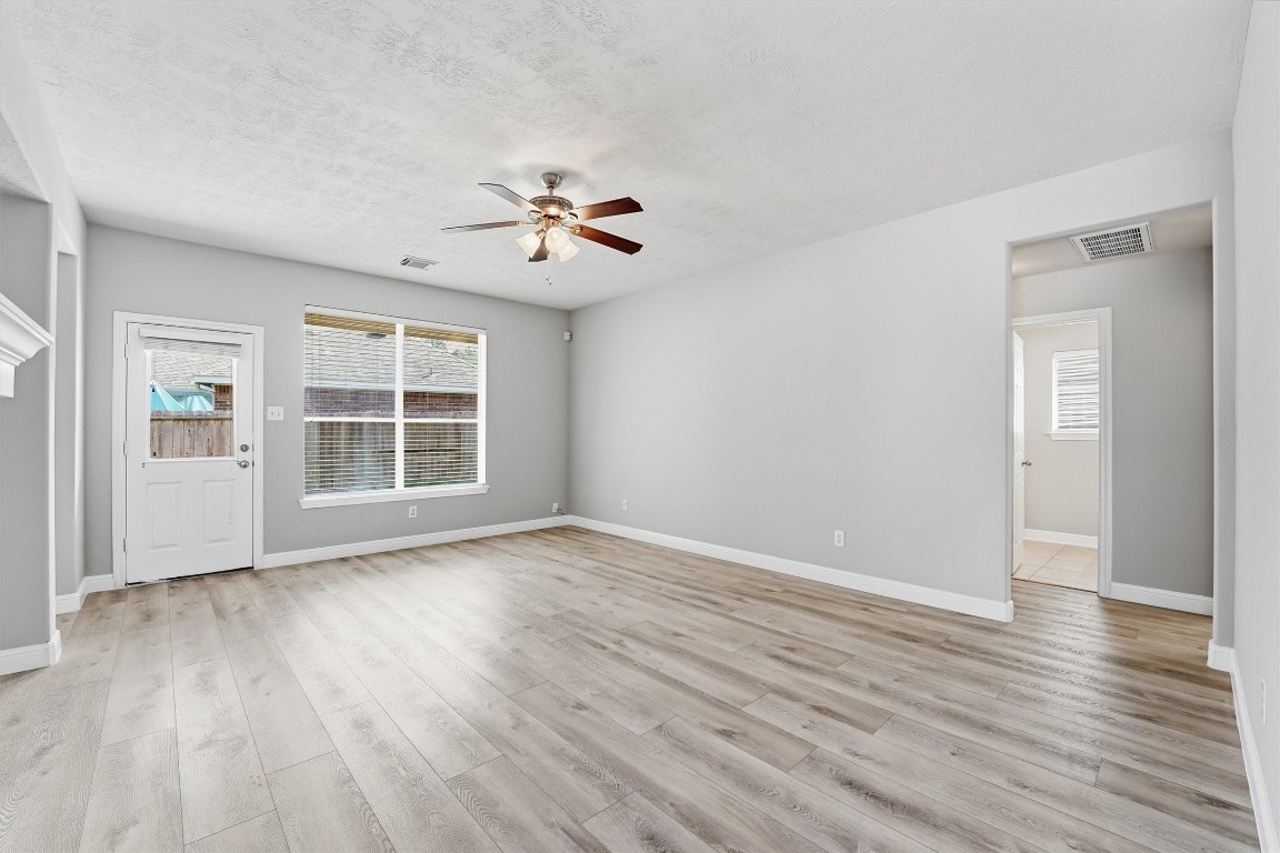 23301 Tuttle Court Porter, TX 77365 - Photo 23 of 50 wooden floor in an empty room with a window