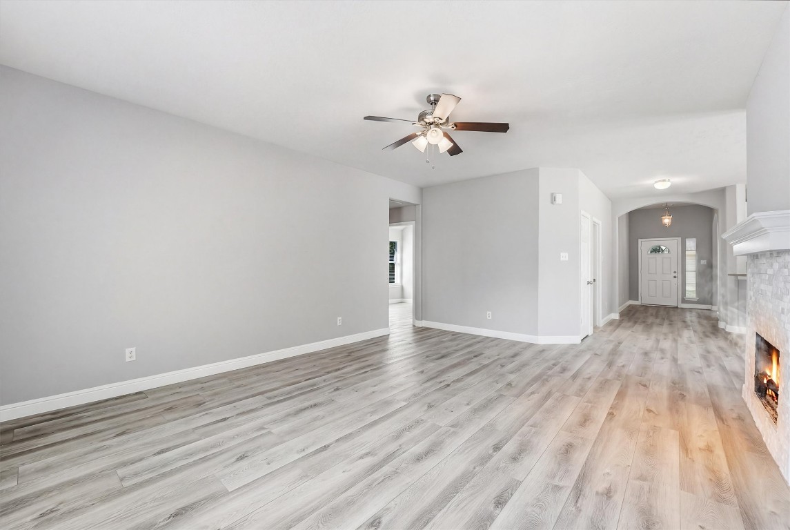 23301 Tuttle Court Porter, TX 77365 - Photo 26 of 50 a view of empty room with wooden floor and ceiling fan