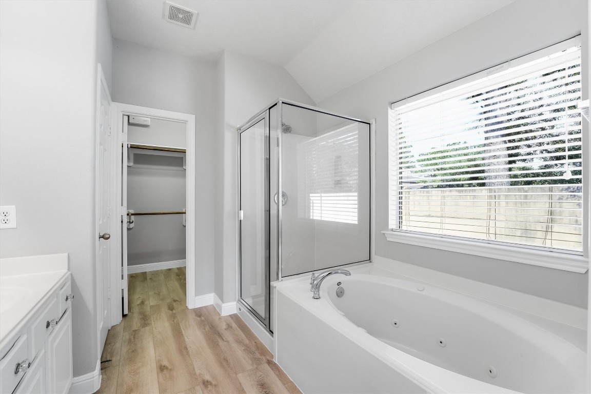 23301 Tuttle Court Porter, TX 77365 - Photo 29 of 50 a bathroom with a bathtub a toilet and a shower