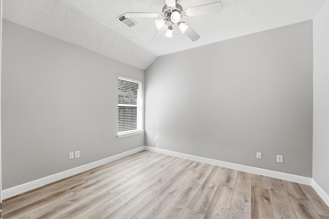23301 Tuttle Court Porter, TX 77365 - Photo 32 of 50 wooden floor in an empty room with a window