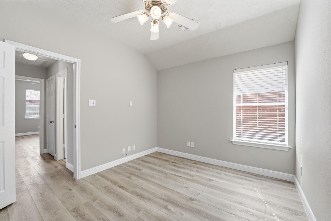 23301 Tuttle Court Porter, TX 77365 - Photo 33 of 50 a view of an empty room with wooden floor and a window