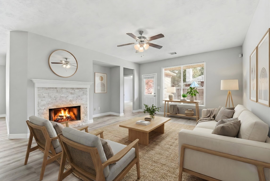 23301 Tuttle Court Porter, TX 77365 - Photo 4 of 50 a living room with furniture a fireplace and a large window
