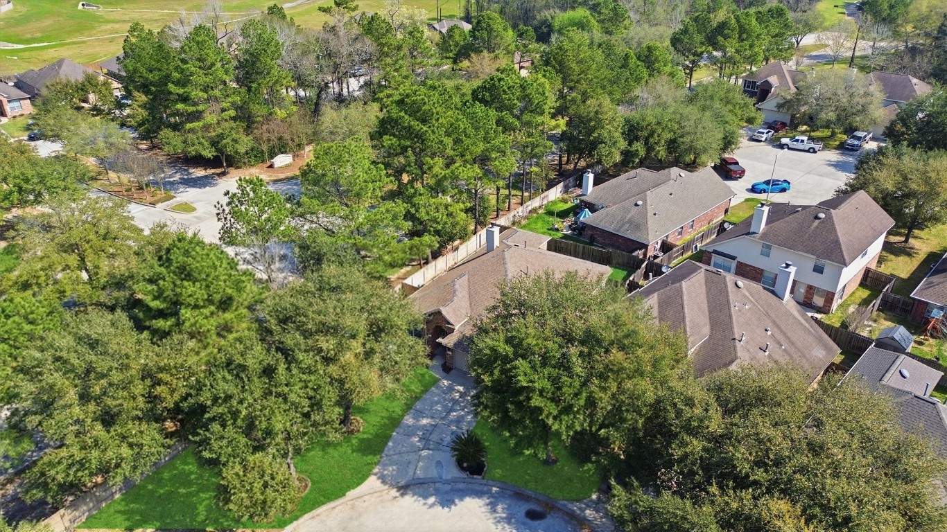23301 Tuttle Court Porter, TX 77365 - Photo 44 of 50 an aerial view of residential house with outdoor space and trees all around
